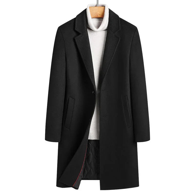 Black wool overcoat layered over white turtleneck sweater on wooden hanger