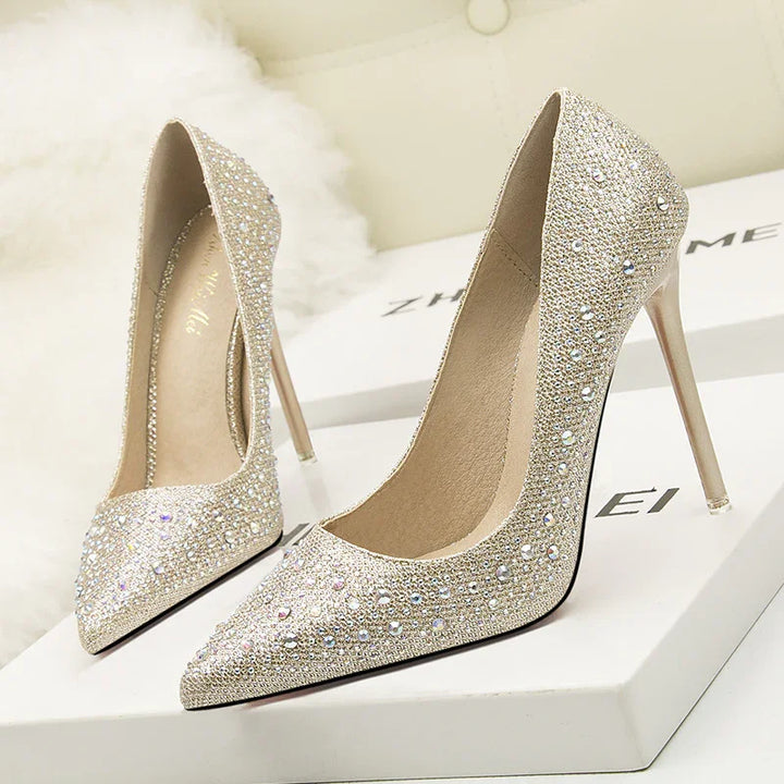 Elegant sparkling high heel stiletto shoes with rhinestones on white box display