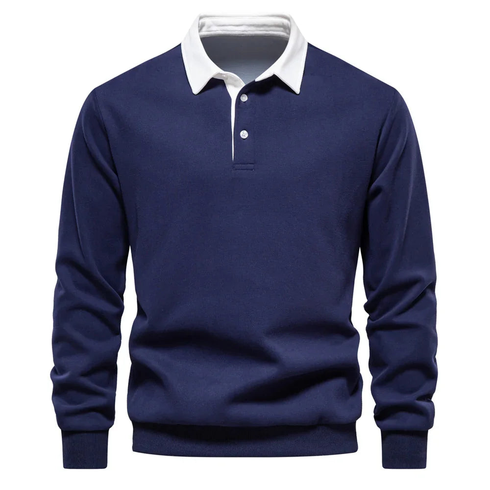 Navy blue long sleeve polo shirt with white button-up collar on white background