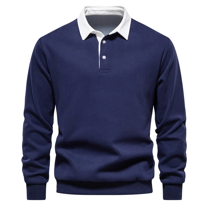 Navy blue long sleeve polo shirt with white button-up collar on white background