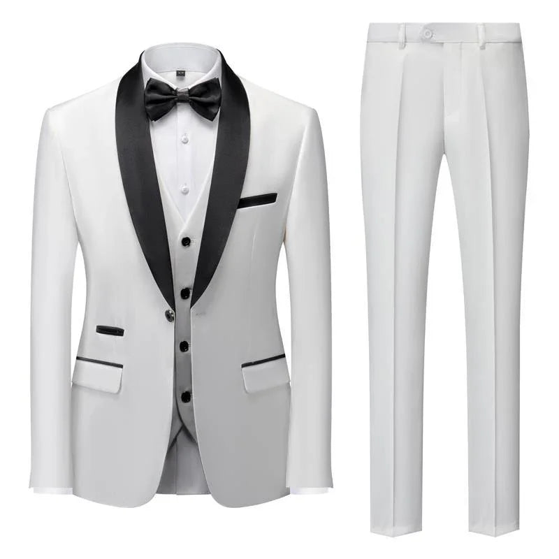white men's tuxedo suit with black satin shawl lapel, black buttons, bow tie, vest, and white dress pants
