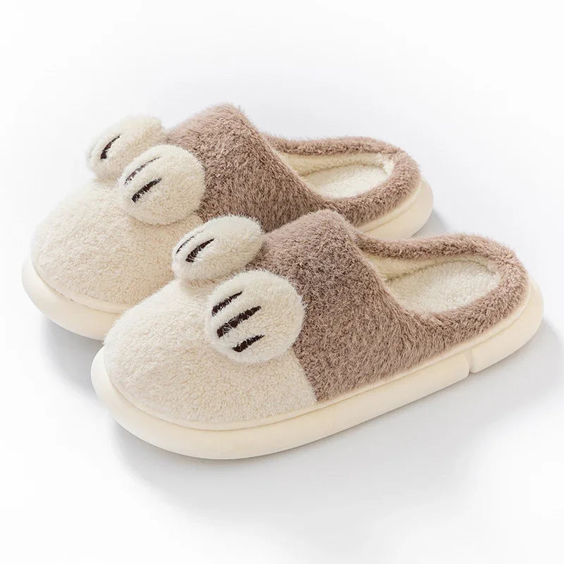 Cozy beige and brown plush indoor slippers with cute paw print design and soft sole