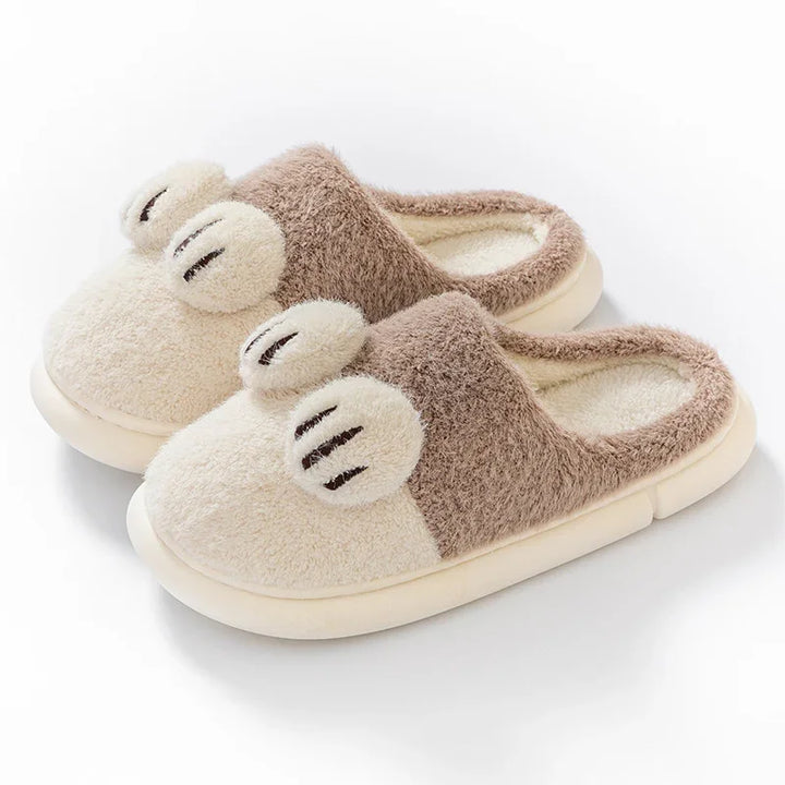 Cozy beige and brown plush indoor slippers with cute paw print design and soft sole