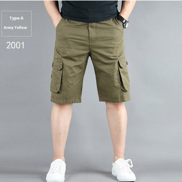 Front view of man wearing army yellow cargo shorts with side pockets and white sneakers