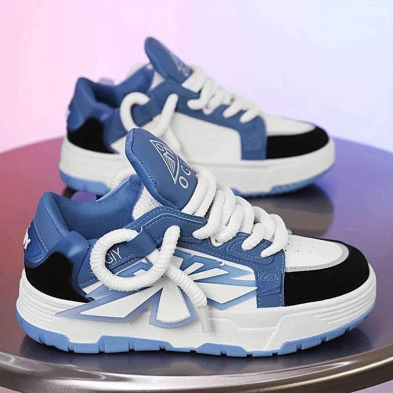 Blue and white stylish sneakers with black accents and thick white laces on a reflective surface