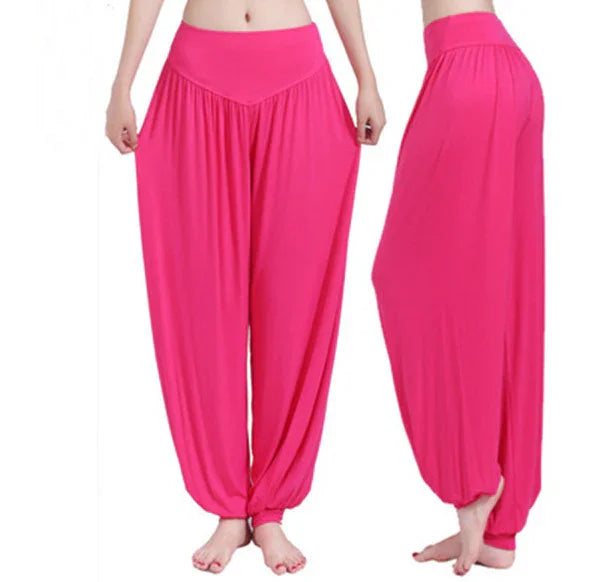 Bright pink loose-fit harem pants with gathered waist and ankles shown front and side views