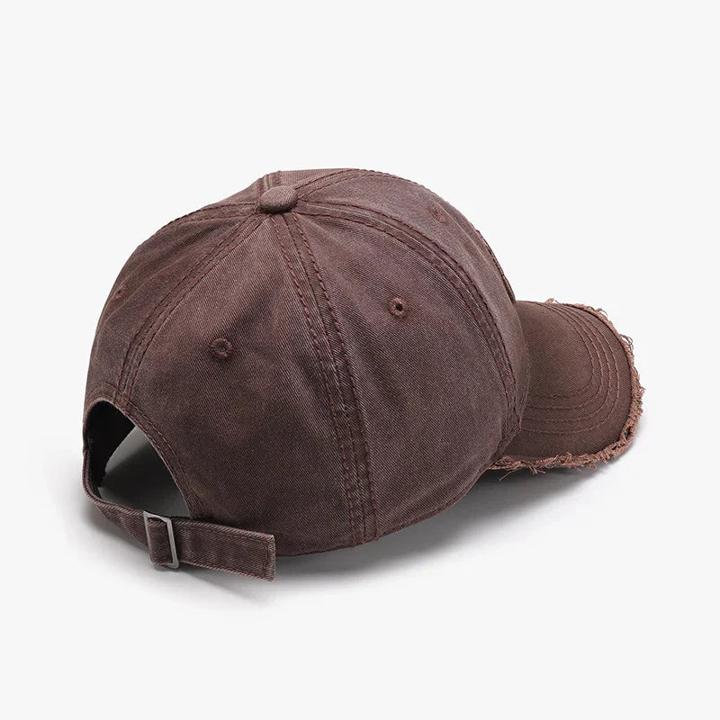 brown distressed cotton baseball cap with adjustable metal buckle on white background