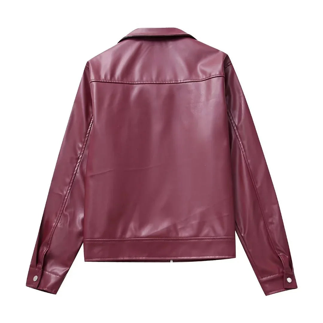 Back view of a maroon faux leather jacket with long sleeves and snap button cuffs on white background