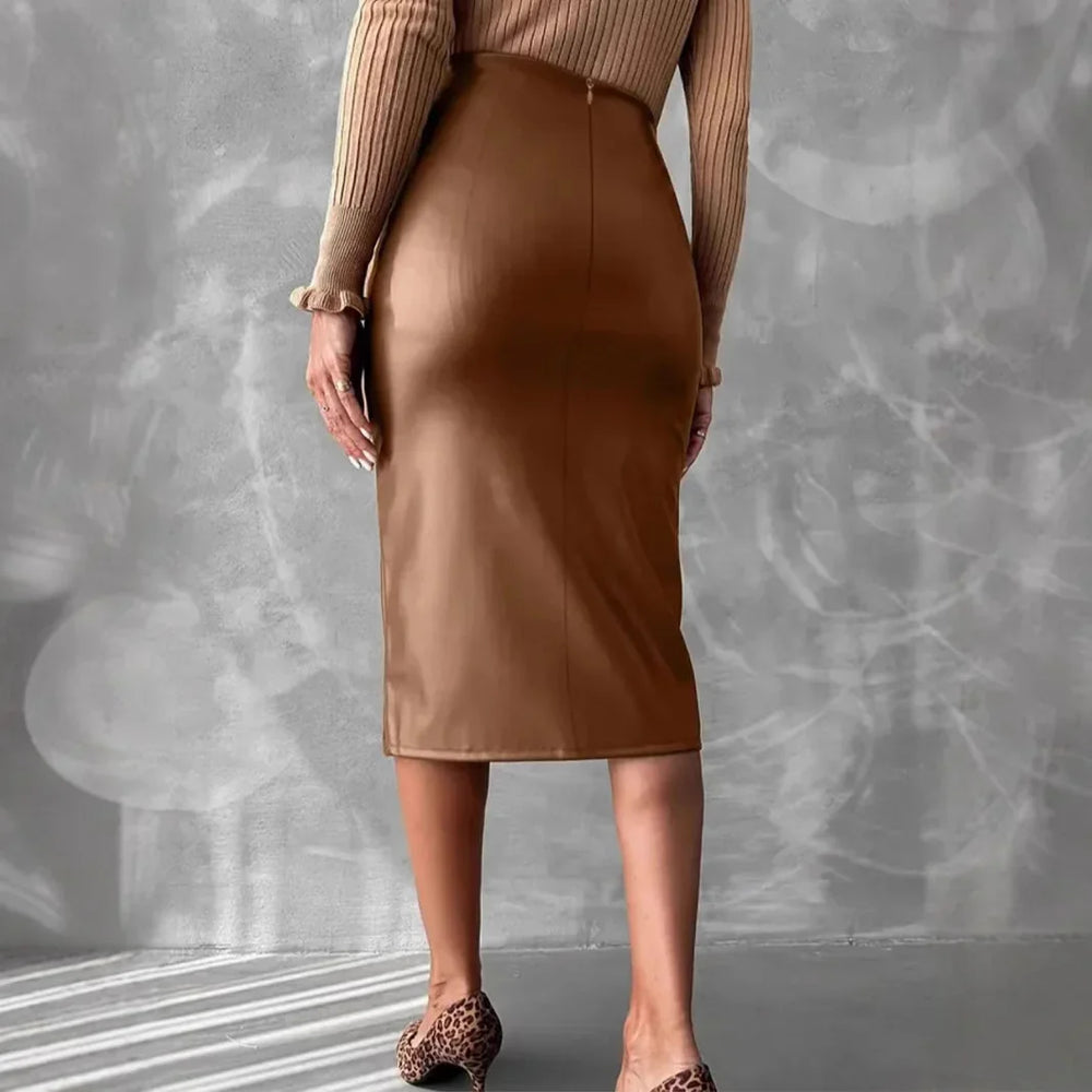 Back view of woman wearing brown fitted midi skirt and beige ribbed sweater with leopard print heels