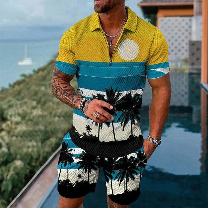 Man wearing tropical palm tree print matching shirt and shorts set with yellow, blue, white, and black colors