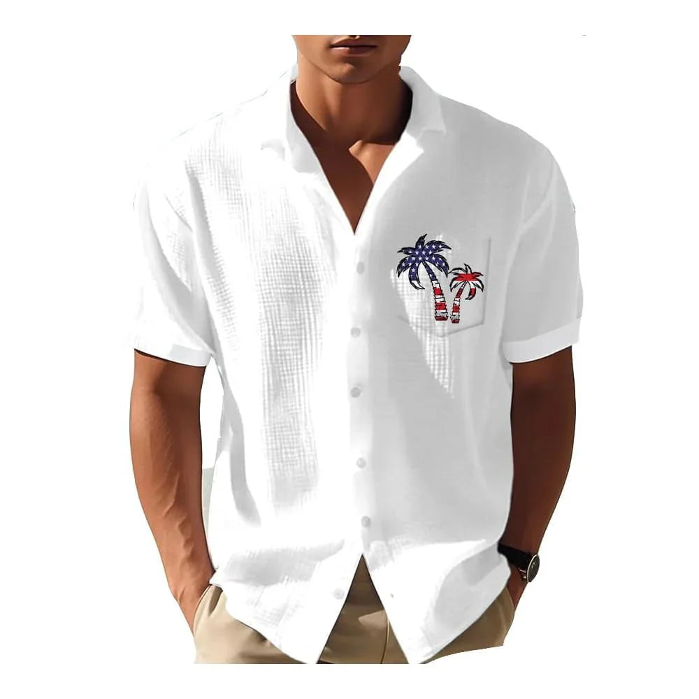 Man wearing white short-sleeve button-up shirt with American flag palm tree embroidery