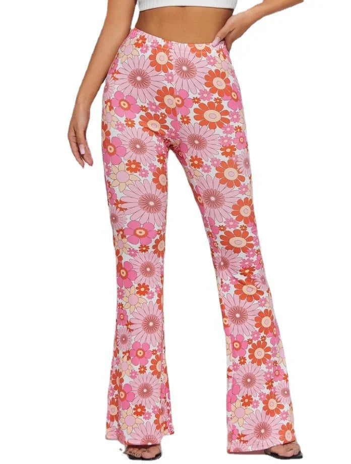 Woman wearing high-waisted pink floral flare pants with large retro flowers pattern