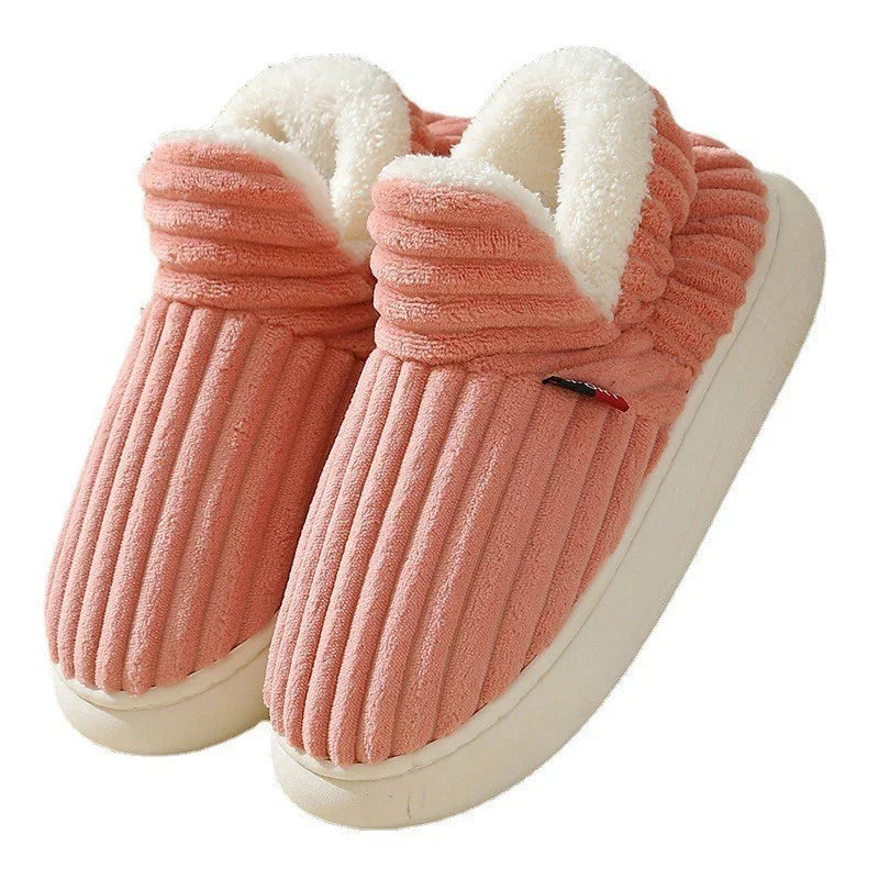 Pink ribbed plush indoor slippers with white fluffy lining and thick white soles