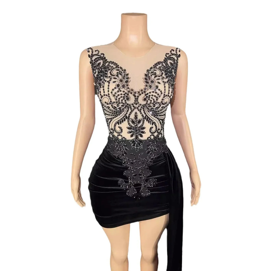 Sleeveless black mini dress with intricate beaded embroidery and velvet skirt on mannequin