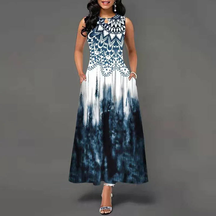 Woman wearing sleeveless maxi dress with blue and white abstract pattern and pockets