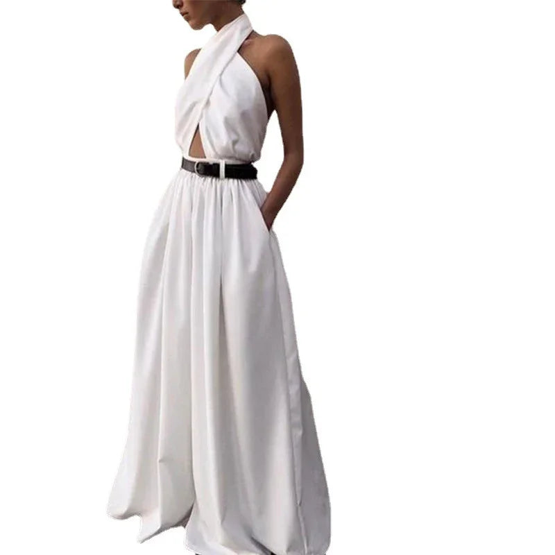 woman wearing stylish white halter-neck dress with high waist black belt and pockets