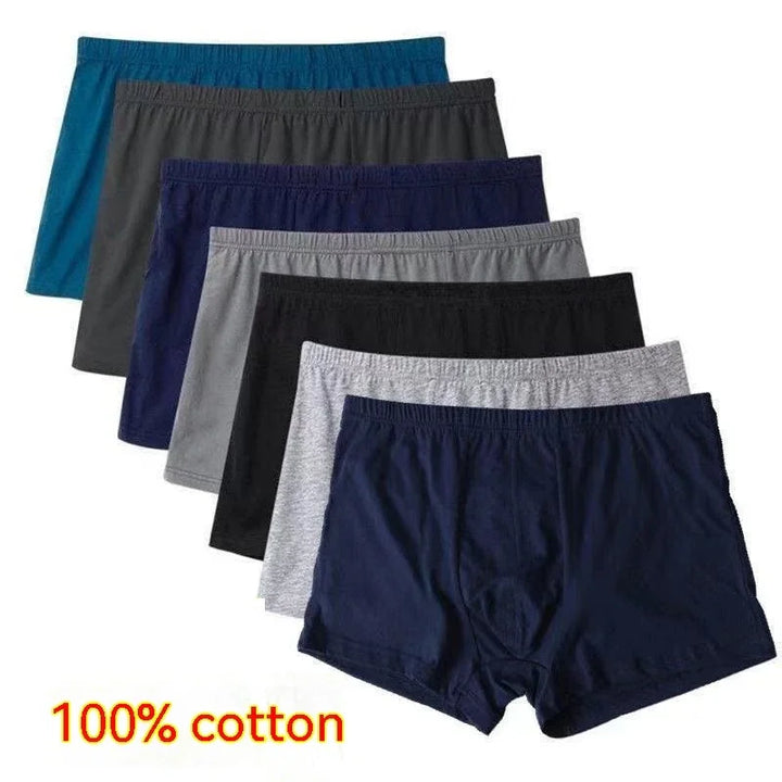 Set of seven men's cotton boxer briefs in assorted colors including navy, gray, black, and blue