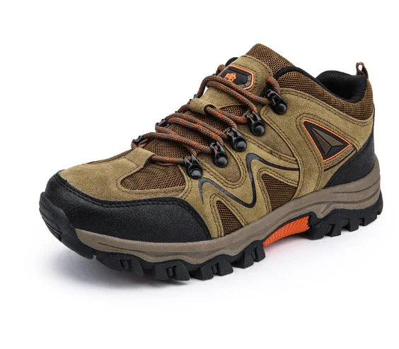 Brown and black hiking shoe with orange accents and rugged sole for outdoor trekking