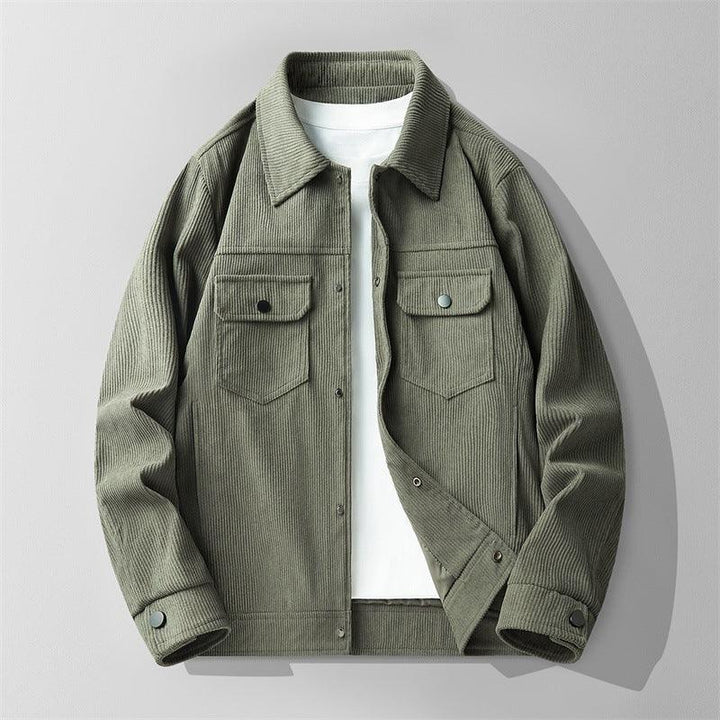 Men's olive green corduroy jacket with buttoned chest pockets over a white T-shirt