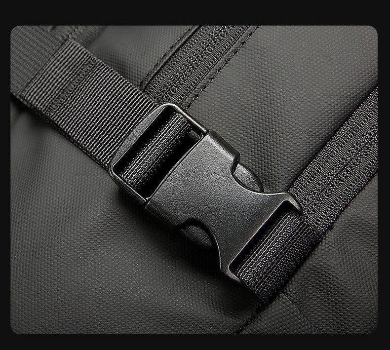 Close-up of black plastic buckle and strap on textured black fabric backpack