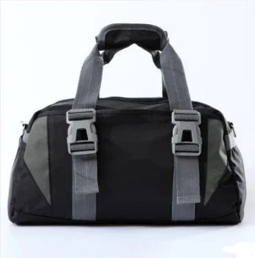 Black and gray duffel bag with double straps and buckle accents on white background