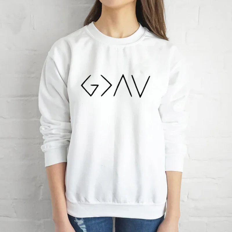Woman wearing white sweatshirt with bold black abstract geometric design on front