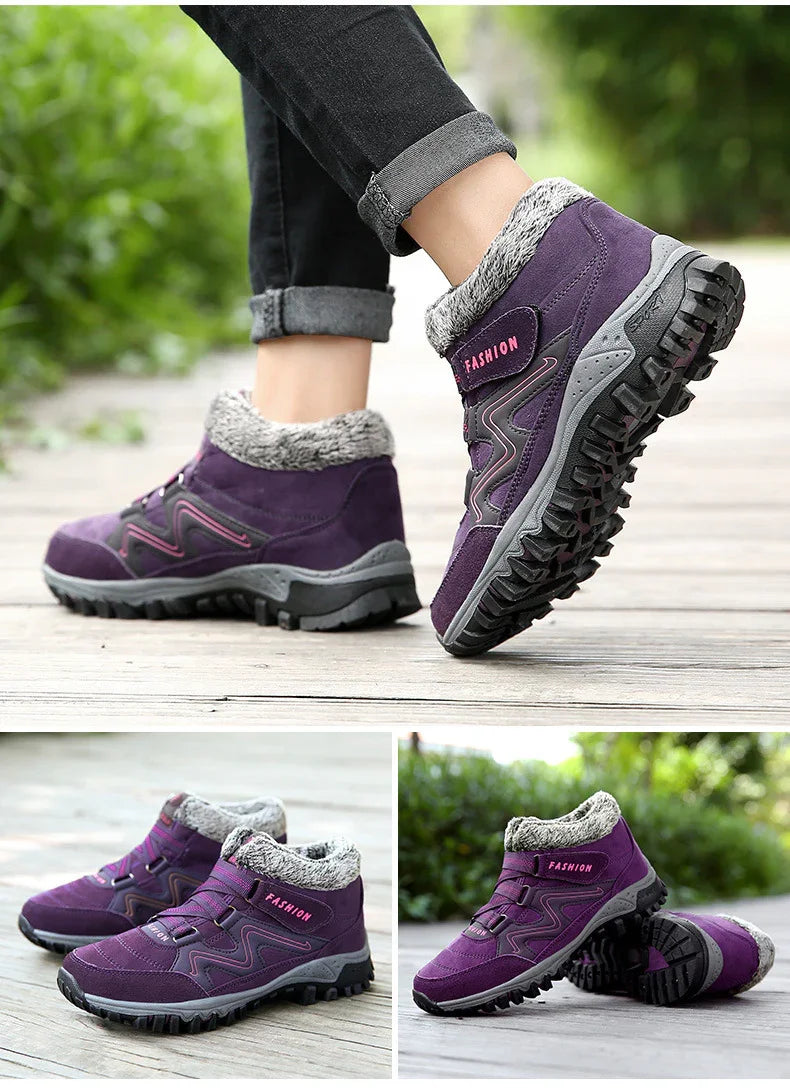 Purple winter hiking boots with faux fur lining and rugged soles on wooden deck