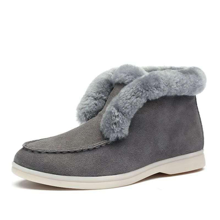 Gray suede ankle boots with plush fleece lining and white rubber sole for winter comfort
