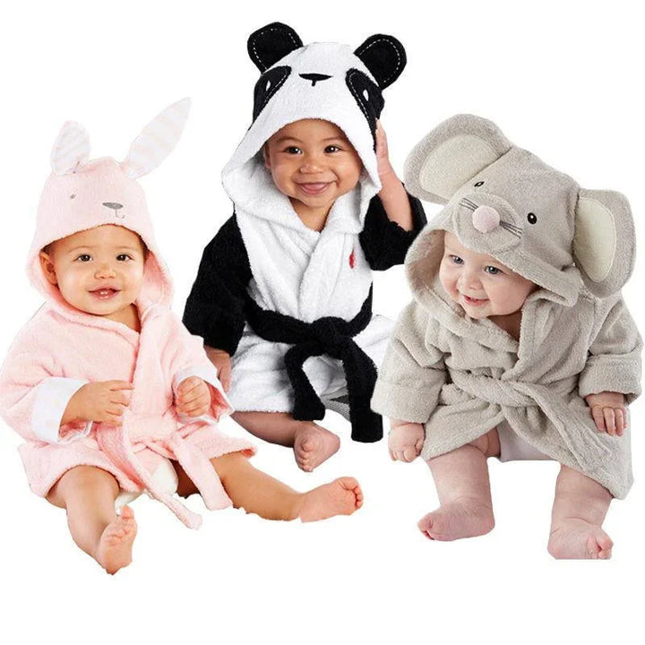 Three babies wearing cute animal hooded bathrobes: pink bunny, black and white panda, and gray mouse