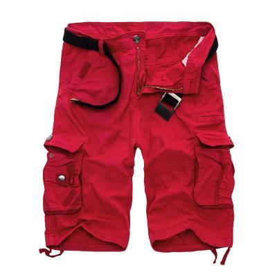 Red men's cargo shorts with multiple pockets and adjustable straps isolated on white background