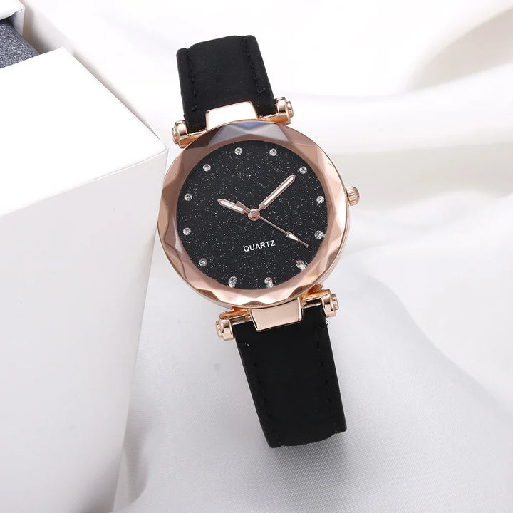 Elegant black quartz wristwatch with rose gold faceted bezel and crystal hour markers