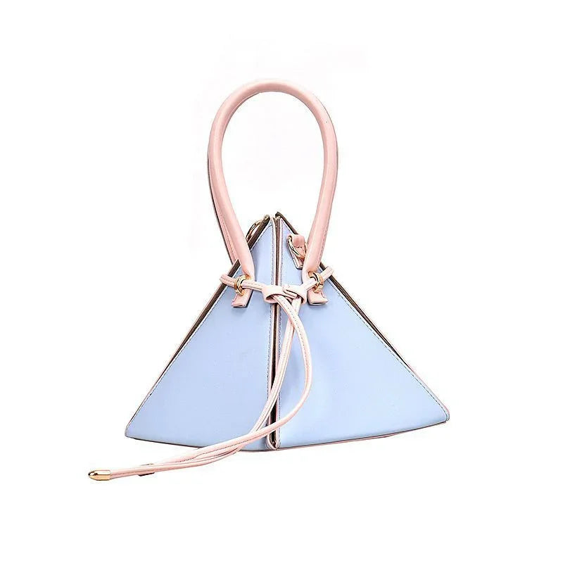 Light blue triangular handbag with pink handle and drawstring closure on white background
