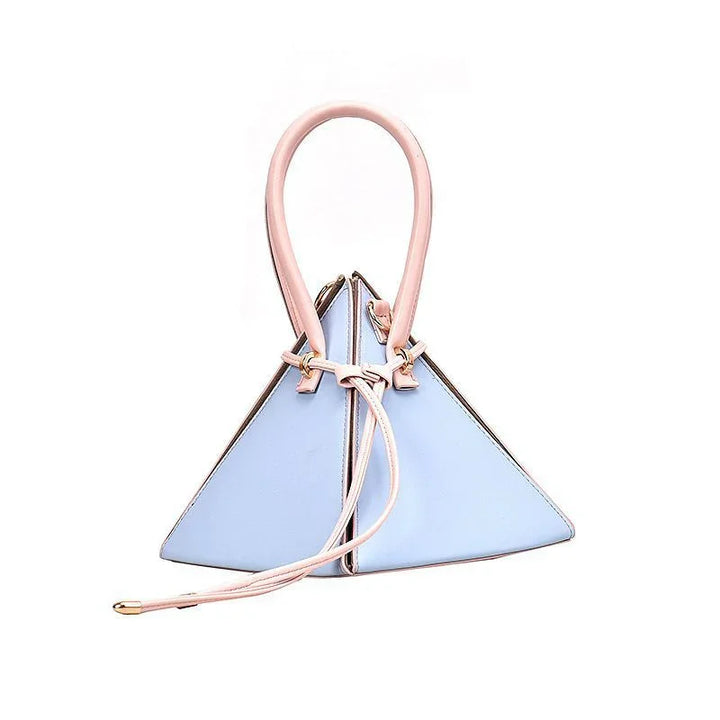 Light blue triangular handbag with pink handle and drawstring closure on white background