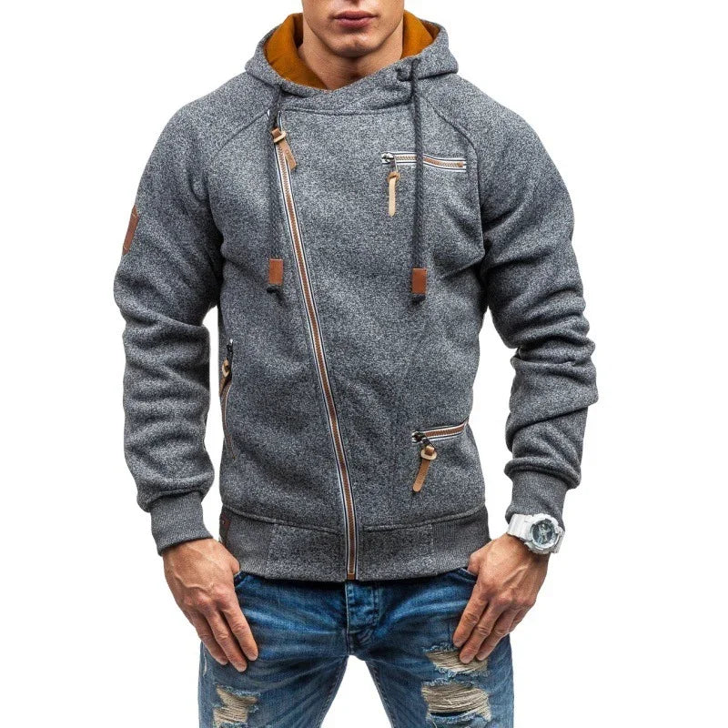 Man wearing stylish gray zip-up hoodie with brown accents and ripped blue jeans