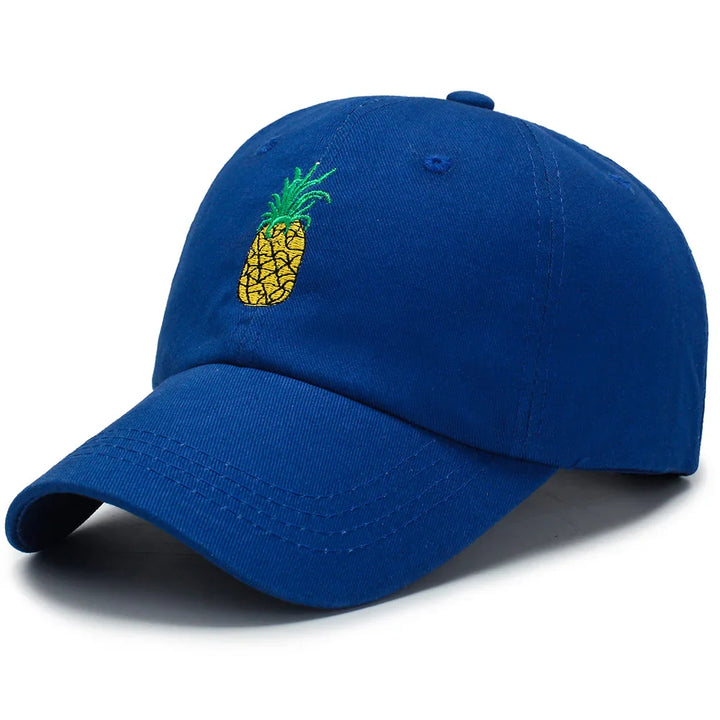Blue baseball cap with embroidered yellow and green pineapple design on front