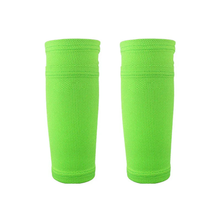Pair of neon green compression calf sleeves on white background