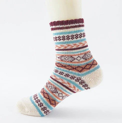 Knitted crew sock with multicolor geometric and stripe patterns in burgundy, blue, and beige