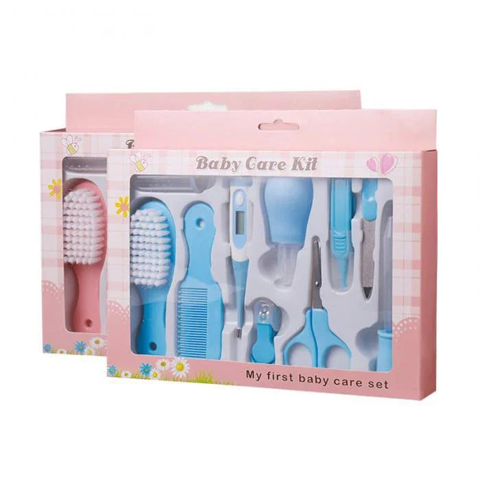 Baby Care Kit in pink box with blue grooming tools including brush, comb, scissors, nail clippers, thermometer