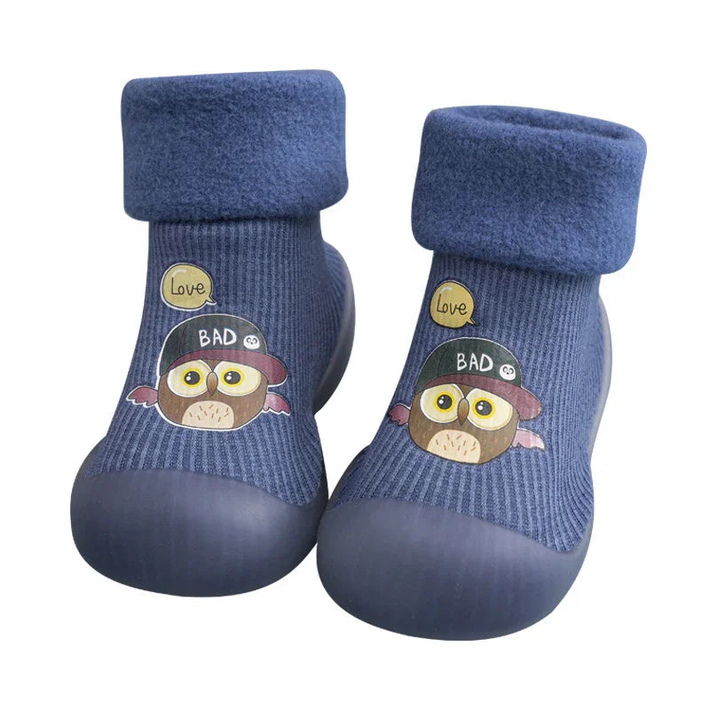 Blue toddler slippers with owl wearing a cap and 'Love Bad' speech bubbles, featuring soft socks and rubber soles