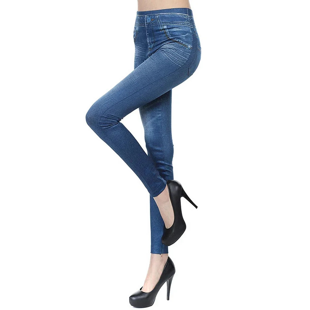 Woman wearing blue skinny jeans and black high heels against white background