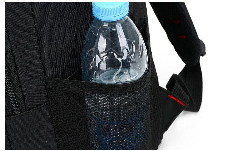 Clear plastic water bottle with blue cap in side mesh pocket of black backpack strap