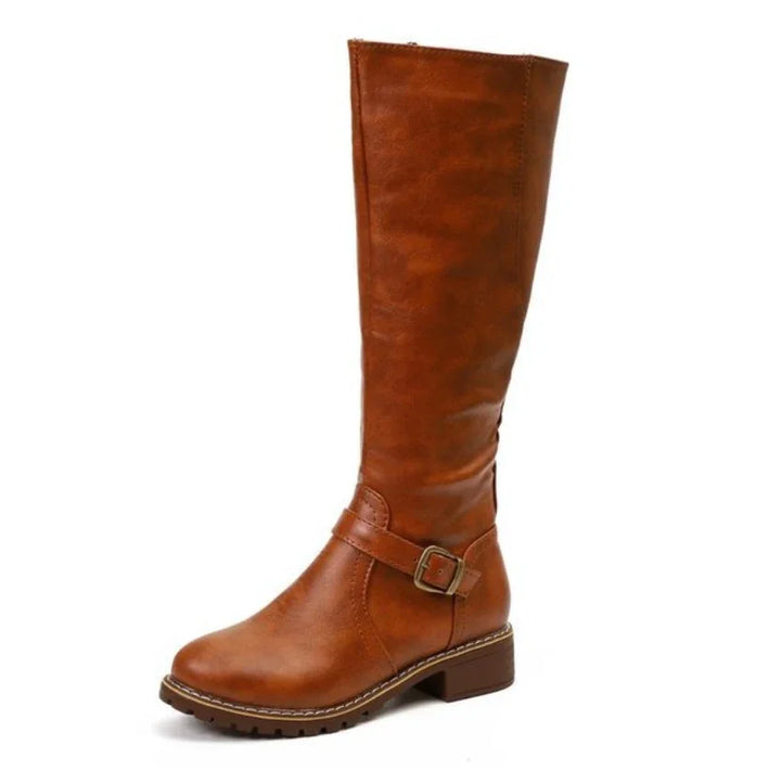 Tall brown leather knee-high boot with buckle strap and low block heel on white background