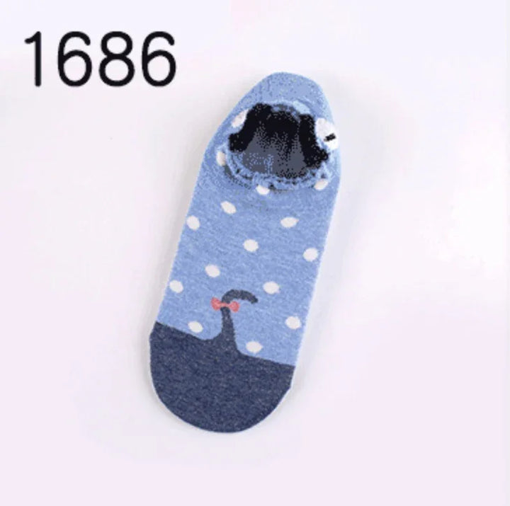 Blue ankle sock with white polka dots and black whale graphic with red bow on toe