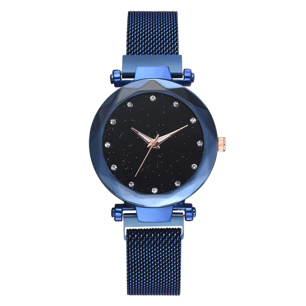 Blue mesh band wristwatch with black starry dial and crystal hour markers