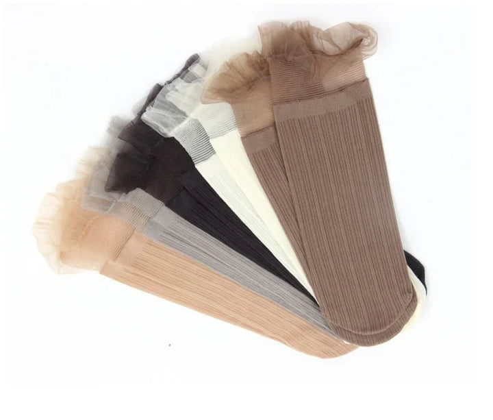 Set of six ribbed ankle socks in beige, brown, gray, black, and cream with sheer ruffle cuffs