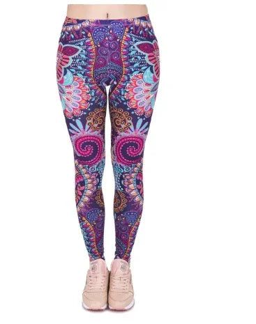 front view of colorful paisley patterned leggings worn with light pink sneakers