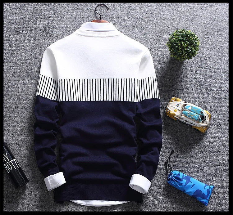 Navy blue and white striped men's sweater displayed on gray carpet with small decorative plant and toy car