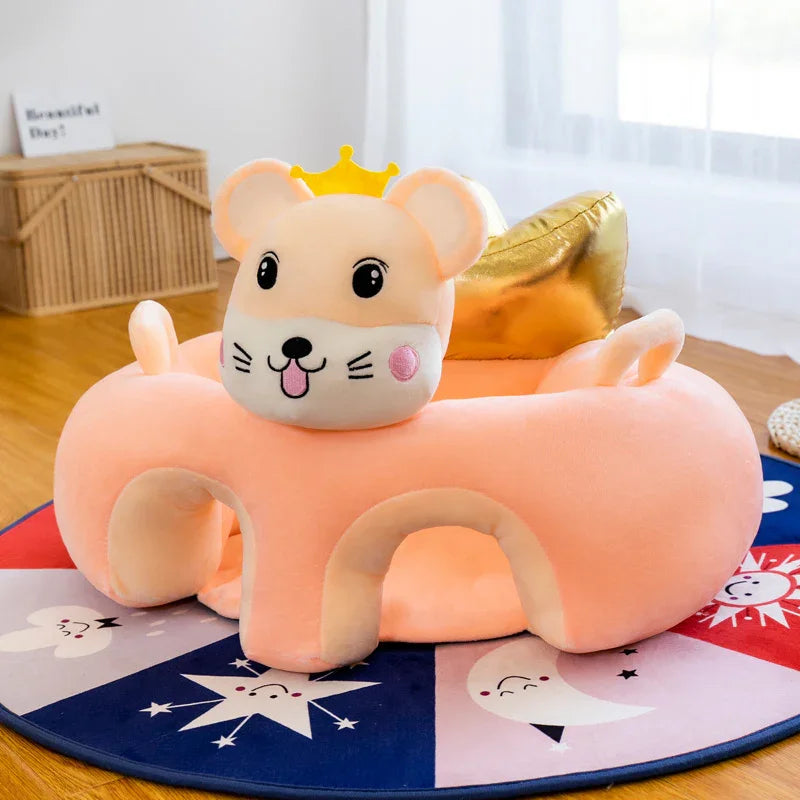 Peach-colored plush pet bed shaped like a cute mouse with a yellow crown on a colorful round mat