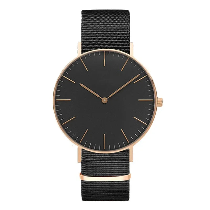 Minimalist wristwatch with black dial, rose gold case, and black nylon strap