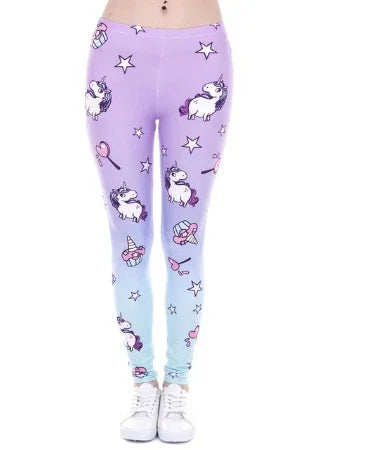 Women's ombre purple to blue leggings with unicorn, stars, and candy print, worn with white sneakers